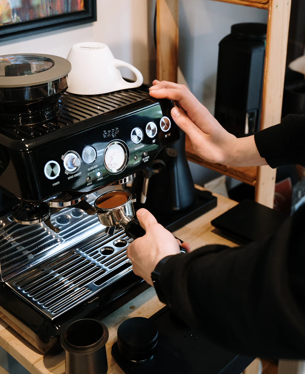 Barista pulling an espresso shot (sample photo)
